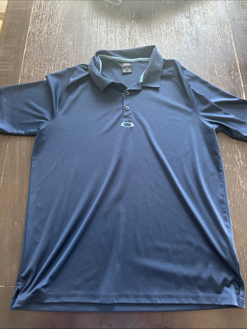 Oakley Men's Dark Blue Performance Polo with Light Blue Logo